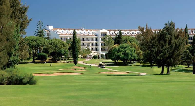Penina Golf Resort Hotel golfers drive their buggies towards the penina golf resort hotel
